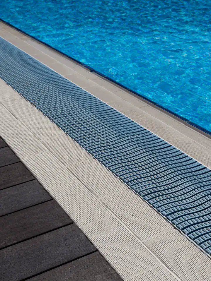 Grated channel drain installation — Long Island